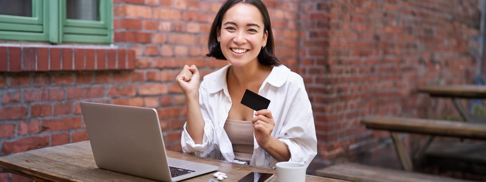 http://img.b2bpic.net/free-photo/happy-young-asian-woman-sitting-near-laptop-holding-credit-card-paying-bills-shopping-online_1258-199308.jpg